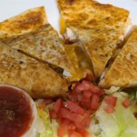 Quesadilla · Cheddar and monterey jack cheese, diced tomatoes, jalapeno peppers, salsa and sour cream.  A...