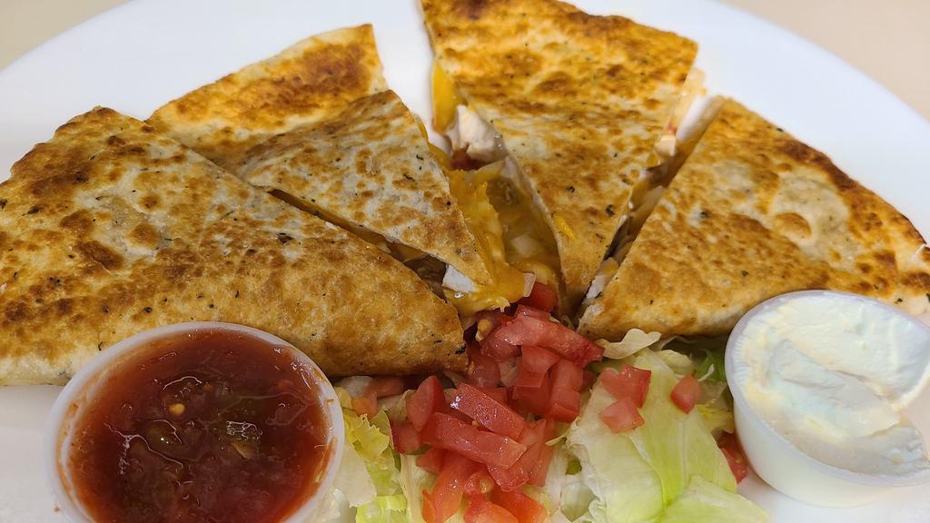 Quesadilla · Cheddar and monterey jack cheese, diced tomatoes, jalapeno peppers, salsa and sour cream.  Add grilled veggies, guacamole, beans or chili, beef, grilled chicken, or filet mignon for an additional charge.