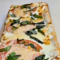 Margherita Flatbread · Thin crisp crust with mozzarella, tomato, basil parmigiana cheese.