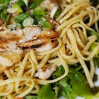 Asian Chicken Salad · Grilled chicken, pasta noodles, scallion, mandarin oranges on a bed of mixed greens with a s...