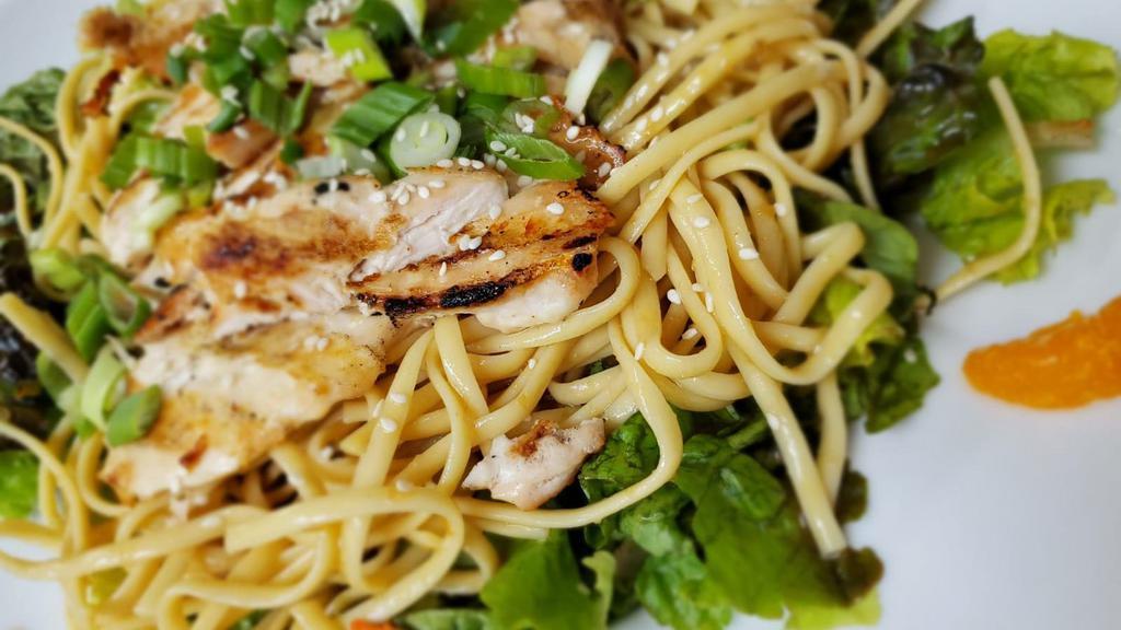 Asian Chicken Salad · Grilled chicken, pasta noodles, scallion, mandarin oranges on a bed of mixed greens with a sesame seed ginger dressing. * contains peanut oil.