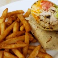 Chicken Wrap · Grilled chicken, lettuce, tomato, cheddar, and Monterey jack cheese in an herb garlic flour ...
