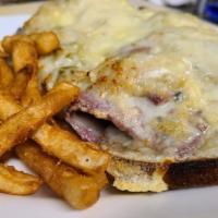 Reuben · Corned beef on rye, sauerkraut, Russians dressing and baked with a layer of swiss, served op...