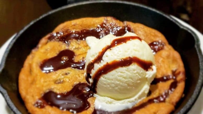 Chocolate Chip Skillet · Giant chocolate chip cookie served in our iron skillet, served with ice cream and chocolate drizzle.