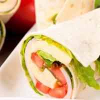Chicken Caesar Wrap · Delicious wrap made with Chicken, mozzarella cheese, and Caesar dressing, topped with lettuc...