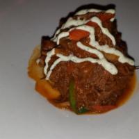 Ropa Vieja (Lunch) · Slow cooked shredded beef, onions and peppers.