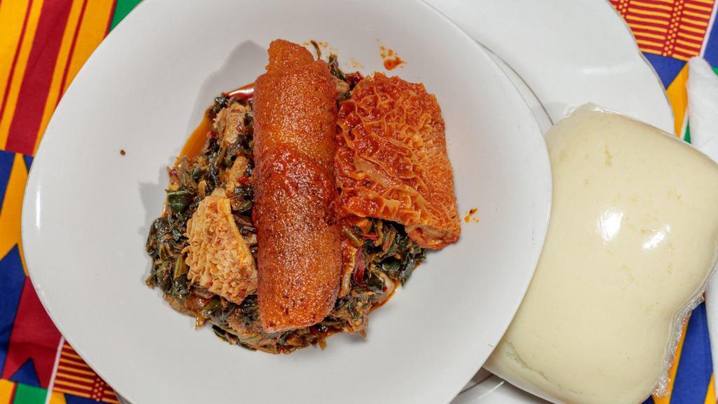 Egusi Soup · Made of special mixed of melon seeds and spinach casserole, garnished with stockfish and served with assorted meats or fish and Choice of Meal.