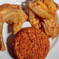 Jollof Rice · Parboiled rice cooked in peppers, onions, tomatoes and spices. Served with chicken, turkey a...