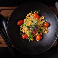 Green Papaya Salad · finely julienned green papaya, long beans, mango, and cherry tomatoes, dressed in a sweet & ...
