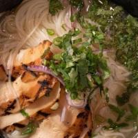 Pho Ga · topped with slices of grilled chicken, served with *chicken stock broth*