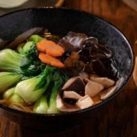 Pho Veggie · topped with baby bok choy, carrot, and shiitake and wood ear mushrooms, in a healthy 