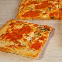 Grandma Vodka Pizza · Fresh Mozzarella, Mozzarella, Basil & Vodka Sauce on a Thin Square Crust.