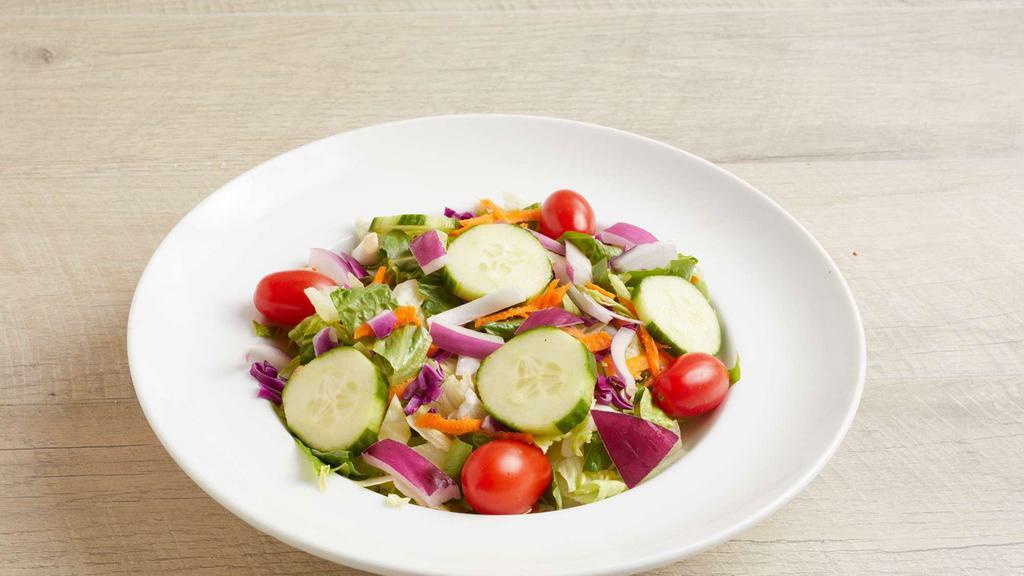 Garden Salad · Mixed Greens, Tomatoes, Cucumber & Red Onions. Served with a Side of House Vinaigrette.