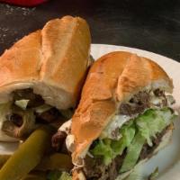 Torta Azteca · Steak, sauteed peppers, onions, cactus, lettuce and jalapeños. Served with oaxaca cheese, bl...