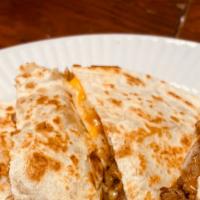 American Quesadilla · Flour tortilla with mozzarella & cheddar cheese you choose any meat from the tacos