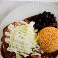 Enchiladas · With beef or chicken Served with rice, black bean and corn tortilla. Topped with lettuce mex...