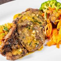 Greek Ribeye · Grilled Ribeye with a lemon butter sauce served with Briami roasted vegetables and Mujaddara...