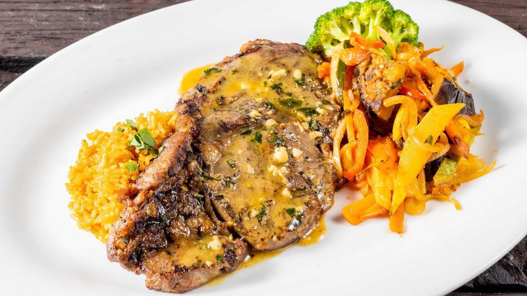 Greek Ribeye · Grilled Ribeye with a lemon butter sauce served with Briami roasted vegetables and Mujaddara lentil rice.