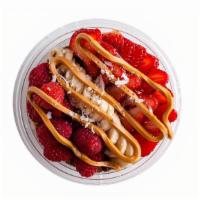Da Nonna Oatmeal Bowl · Chocolate granola, strawberries, banana, raspberries, coconut flakes, & drizzled peanut butt...