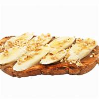 Spuntino Toast · Banana, toasted peanuts, & drizzled honey toasted bread & peanut butter.