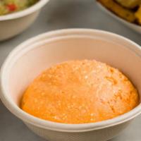 Tirokafteri · Spicy whipped feta spread with sweet and hot peppers. Served with warm pita bread.