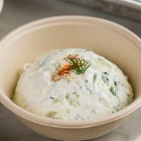 Tzatziki · Classic Greek yogurt spread with cucumber garlic and fresh dill. Served with warm pita bread