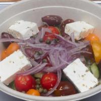 Greek Salad · Fresh seasonal tomatoes, cucumbers, onions, capers, Kalamata olives and feta with extra virg...
