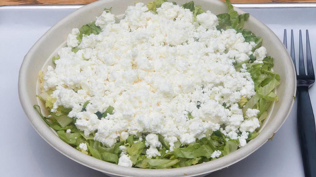 Marouli Salad · Finely chopped crisp Romaine, dill and scallions with feta and extra virgin olive oil and a touch of lemon juice.