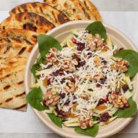 Spinach Salad · Baby spinach, crumbled halloumi, golden raisins, dried cranberries, toasted walnuts and shav...