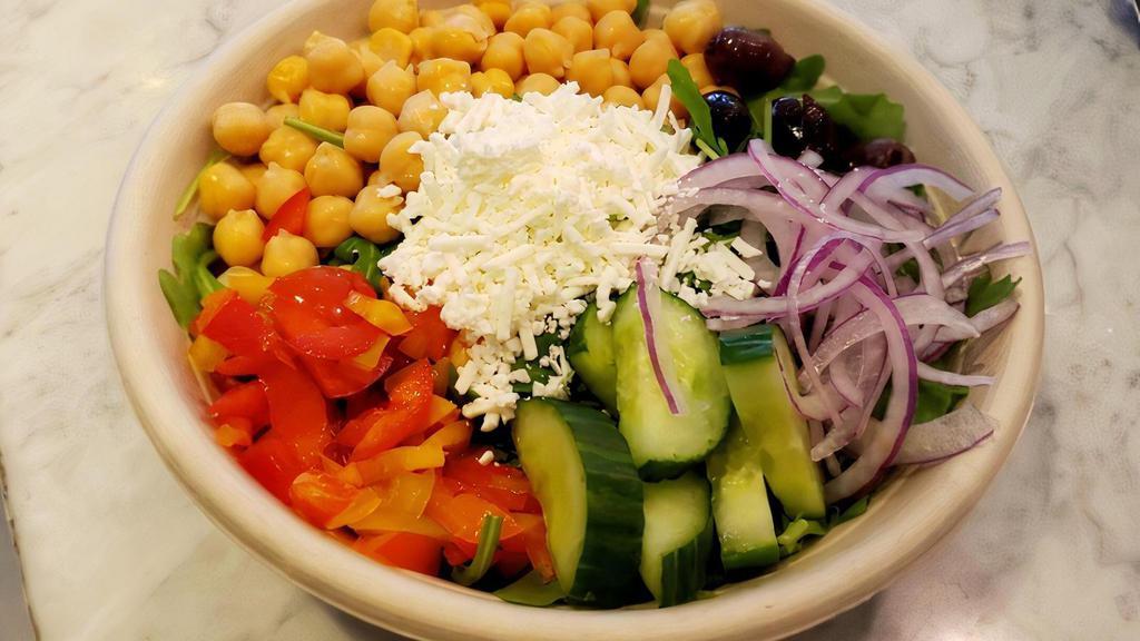 Chickpeas Salad · Arugula topped with Cucumbers, Chickpeas, Olives, Red Onions, Red Peppers and Feta Cheese