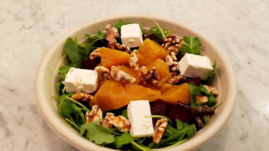 Beet Salad · Arugula roasted beets with feta and toasted walnuts with extra virgin olive oil and balsamic vinegar.
