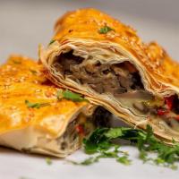 Mushroom Pie · Fresh mushrooms, peppers and Kasseri Cheese wrapped in a flaky fillo crust