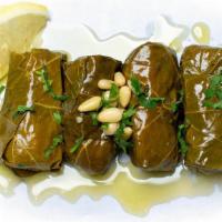 Dolmades (4 Pc) · Hand rolled grape leaves stuffed with rice, currant, golden raisins, pine nuts and herbs ser...