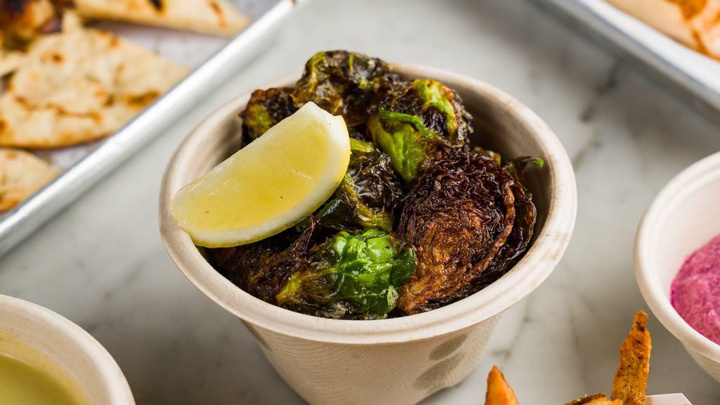 Brussels Sprouts · ROASTED BRUSSEL SPOUTS TOPPED WITH GREEK HERBS AND A LEMON, EXTRA OLIVE OIL DRESSING