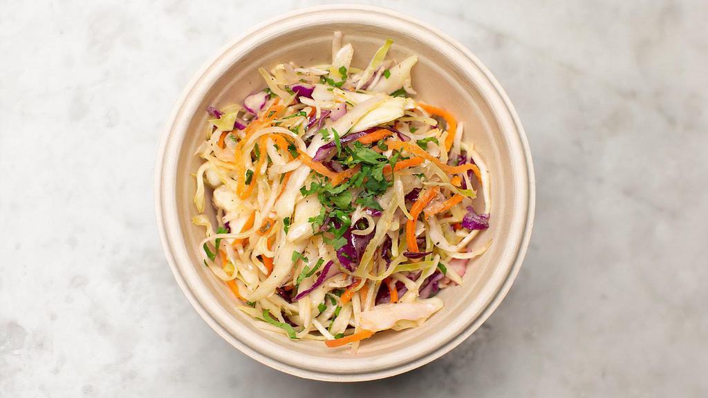 Aegean Slaw · Freshly chopped red and green cabbage with carrots and Mediterranean herbs and spices.