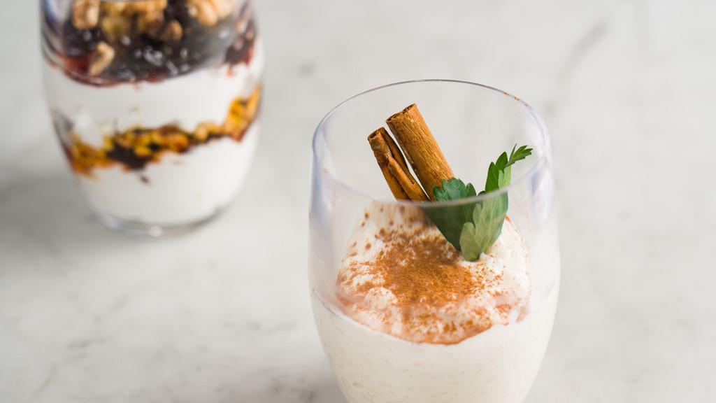 Greek Rice Pudding · Creamy rice pudding topped with freshly ground cinnamon.