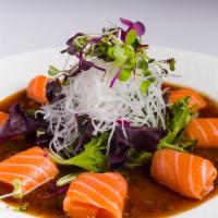 Salmon Sashimi Salad · Scottish salmon, spring mix salad, white radish, onion soy dressing.