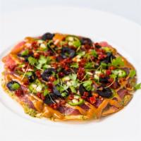 Tuna Pizza · Big eye tuna, guacamole, black olive, cilantro, sundried tomato, jalapeño, spicy cream Aioli.