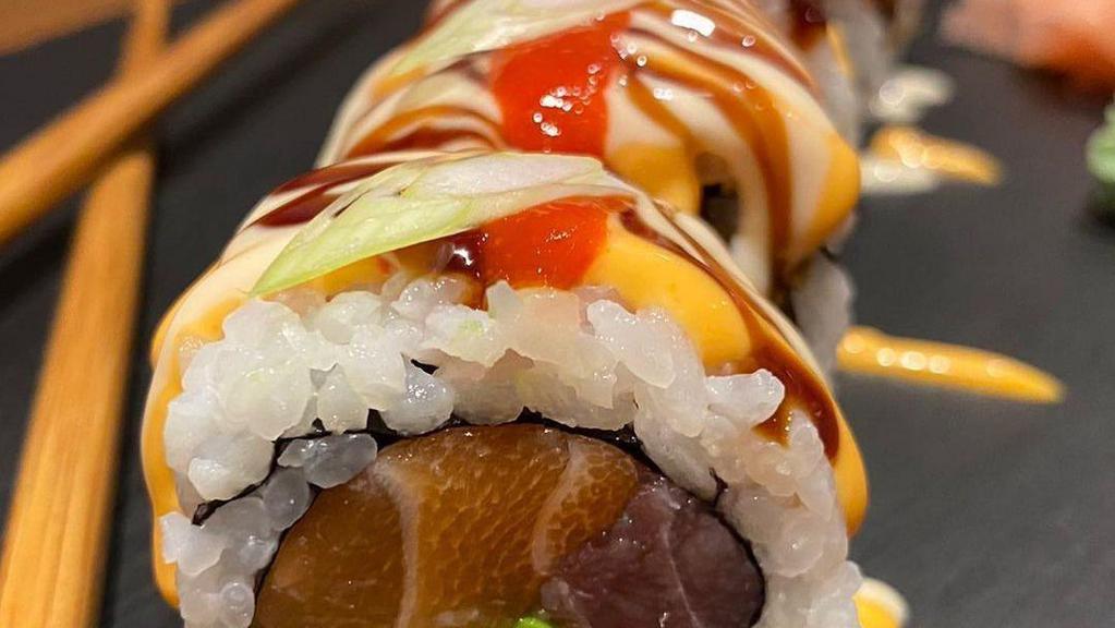 Midori Roll · Salmon, tuna, cucumber, crabmeat roll topped with avocado.
