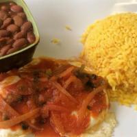 Huevos Rancheros · Fried eggs in tomato sauce served with rice and beans.