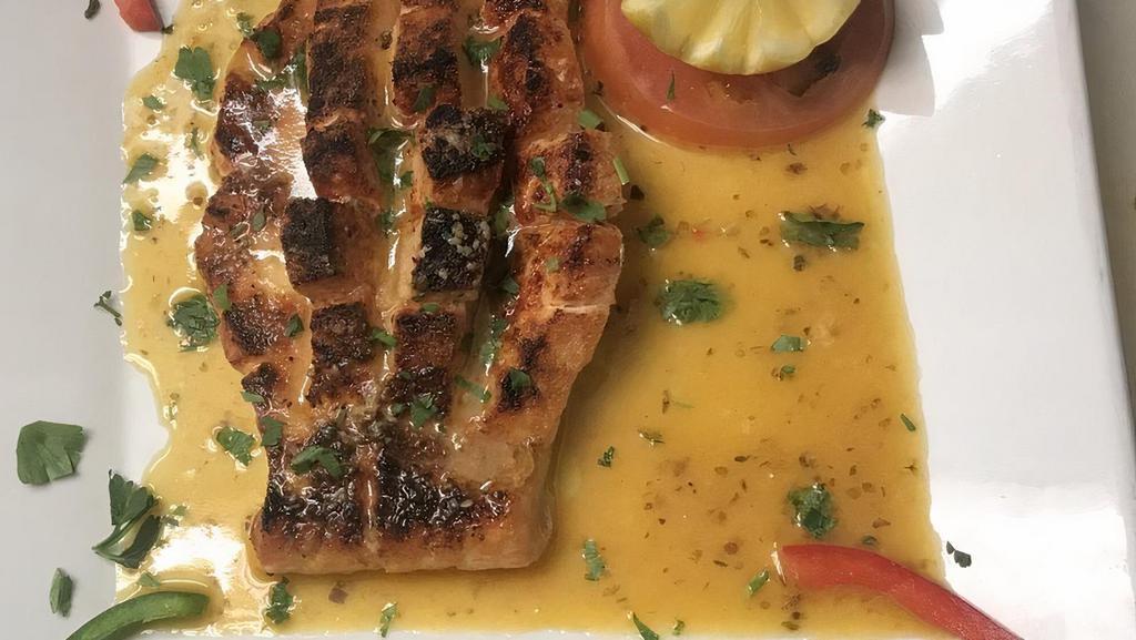 8 Oz. Broiled Salmon Fillet · Served with white wine, lemon and garlic butter sauce.