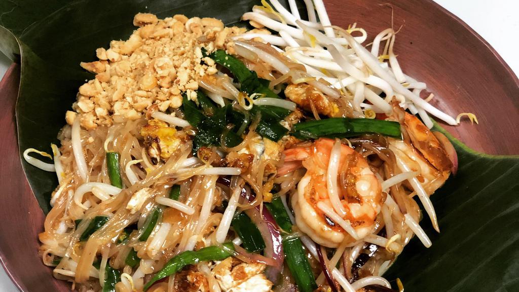 Pad Thai (Contains Dried Shrimp) / ผัดไทย · Rice noodles sautéed with choice of meat, DRIED SHRIMP, PEANUTS, egg, bean curd, bean sprouts, garlic chives, and pickled turnip.