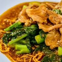 Rad Na Mi Krob / ราดหน้าหมี่กรอบ · Crispy fried egg noodles with choice of meat, Chinese broccoli in brown gravy.