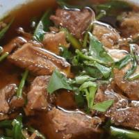 Braised Beef Noodle Soup / ก๋วยเตี๋ยวเนื้อตุ๋น · Rice noodle with slow-cooked beef and beef ball in dark soup.