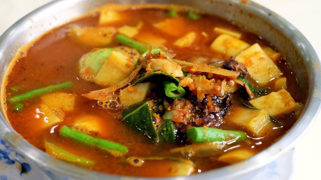 Country Style Curry / แกงป่า · Country style curry paste, bamboo, eggplant, string bean, basil and bell pepper. Spicy.