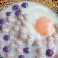 Taro Balls In Coconut Milk / บัวลอยเผือกไข่หวาน · Served with poached egg and young coconut.