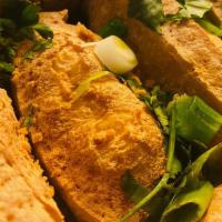 Fried Tofu · Crispy tofu served with house sauce topped with scallion – cilantro mixed, topped with crush...