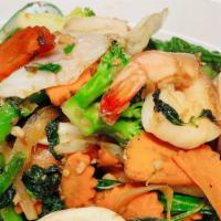 Seafood Basil Sauce · Sautéed seafood with seasonal mixed vegetables in basil sauce topped with fried garlic. Serv...