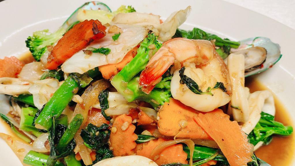 Seafood Basil Sauce · Sautéed seafood with seasonal mixed vegetables in basil sauce topped with fried garlic. Served with jasmine rice.