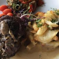 Fillet Mignon · Served with pan fried potatoes and veggies. With Porcini mushroom sauce.